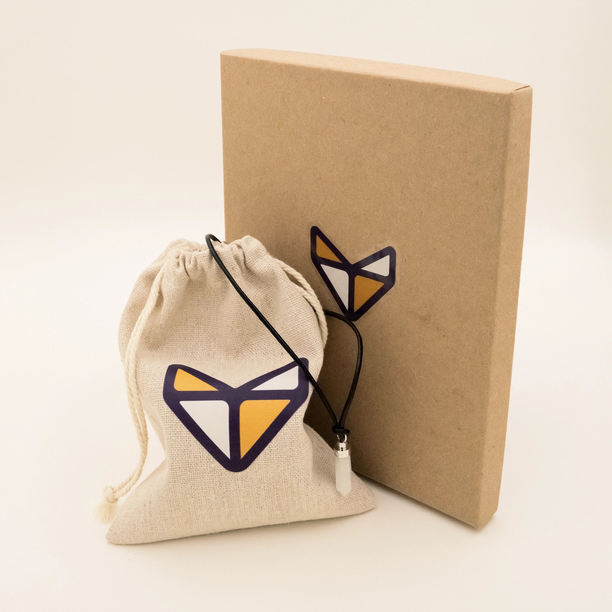 Clear quartz clarity pendant with Teaps linen pouch and kraft paper box
